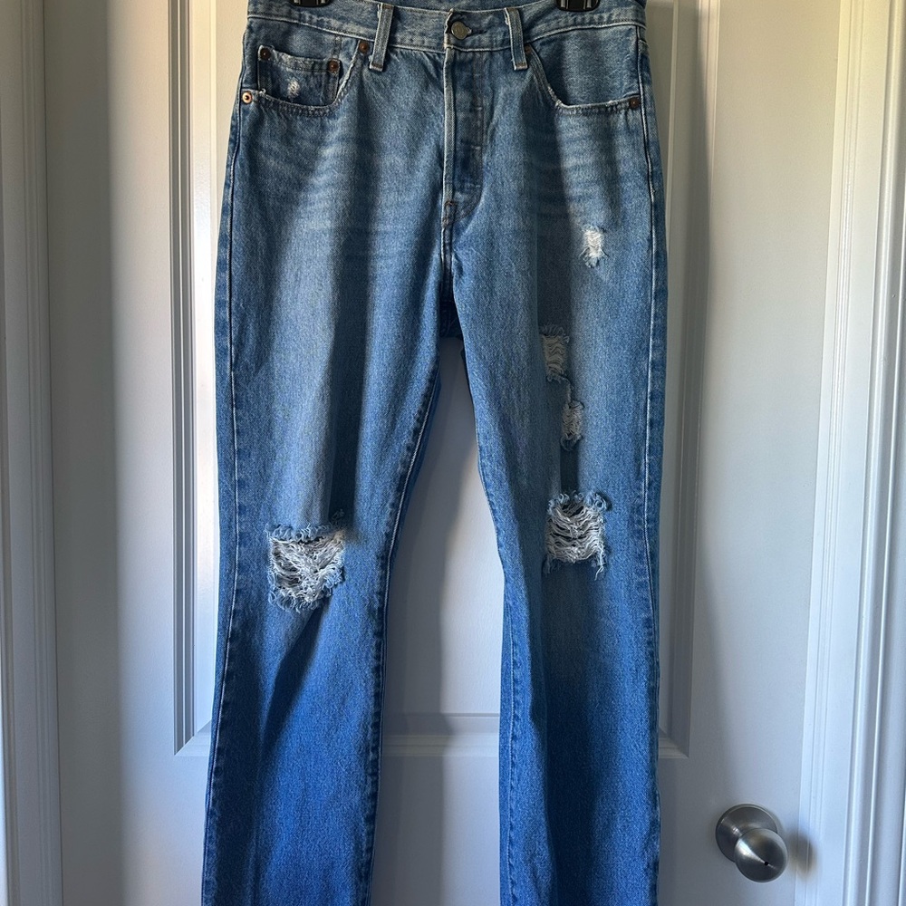 Levi's 501 light blue distressed denim jeans with button fly